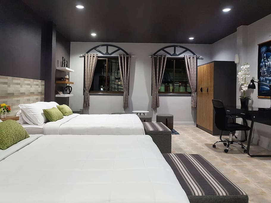 Welcome to our Family Suite with 2 king sized beds, desk/chair, Smart LED TV, free wifi, large wardrobe, latex bed/pillows for extra comfort, sitting area with views of temple, safety box, beach umbrella, quality curtains, laundry bag/service, extra foldout bed available & more greatness for you.