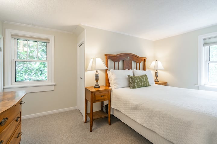 Double Bed guest room with clean linens, pillows and closet. 