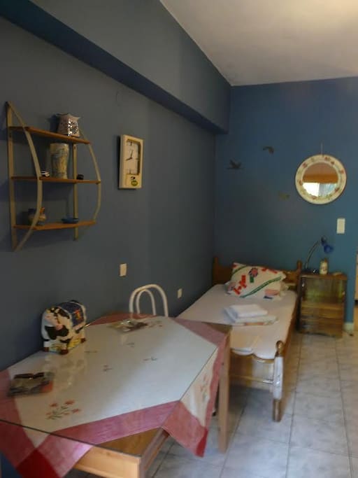 25 m2 apartment for 2 people with 2 single beds fully equipped kitchen for cooking meals , and a small WC with shower and A/C.