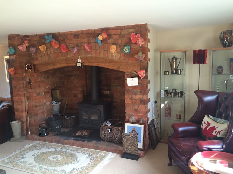 Inglenook Fire Place and cozy wood burner
