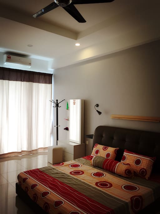 Master bedroom with attached bathroom. King size bed, Aircon, ceiling fan, mirror, hair dryer.