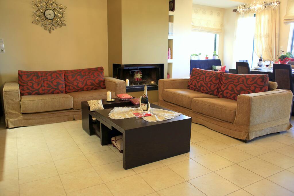 Living room with fire place and comfortable sofas