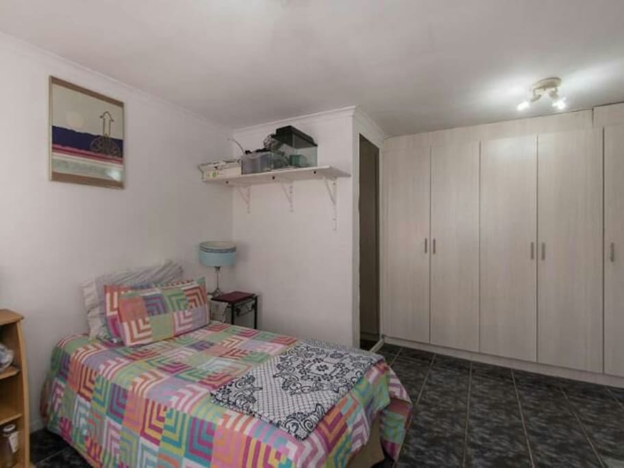 lots of cupboard space and dressing area with a huge long mirror
