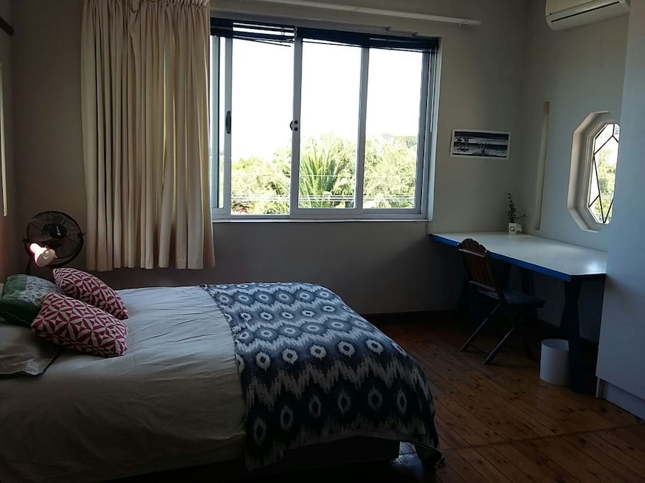 Comfy double bed, desk and work-space and a view to die for!
