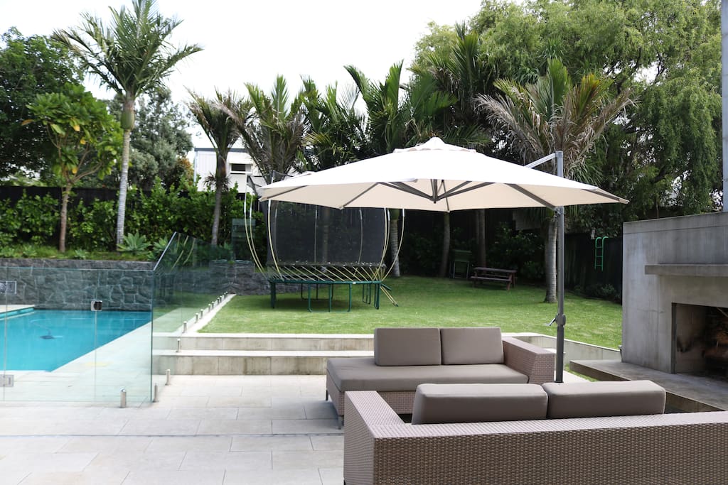 Stunning poolside relaxation, surrounded by greenery.