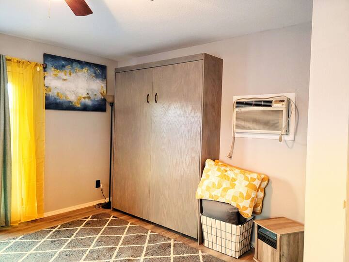 The murphy bed retracts into the wall to ensure more room when it is not in use.