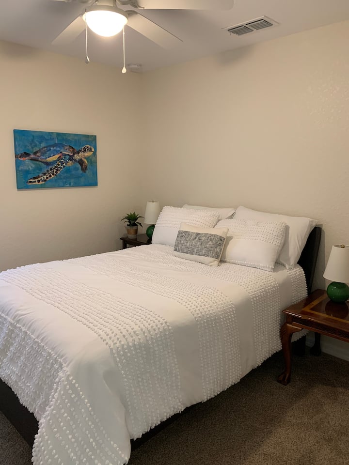 Second guest room with a full size bed and ample closet space.