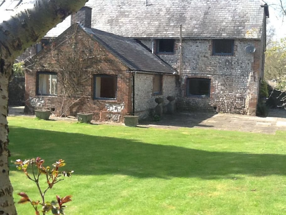 Beautiful Flint Barn Conversion with large lawn facing forest
