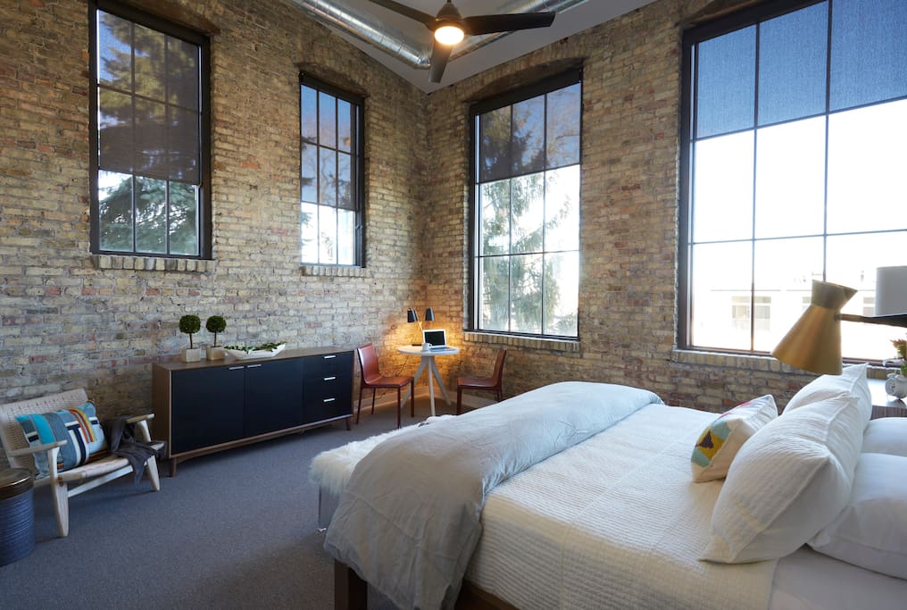 Suite 1: Sitting high atop KK Ave w/ views of Lake Michigan and the MKE cityscape, this 550 sq ft Cream City brick clad corner suite comes replete w/ all the creature comforts of home from king pillow top mattress w Brooklinen Sheets, sitting area, walk-in spa, high speed internet, Apple TV and local cable. As w/ each second floor suite, you can enjoy the comforts of your own suite or chill in the common kitchen next door.