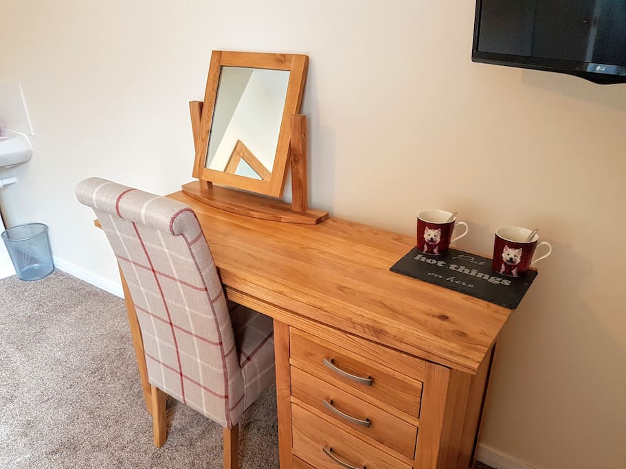 Matching oak dressing table has drawers for storage. In this room you have a built in wardrobe in the alcove.