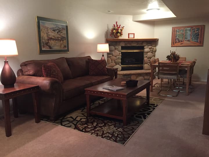 Living room, electric fireplace, dining area