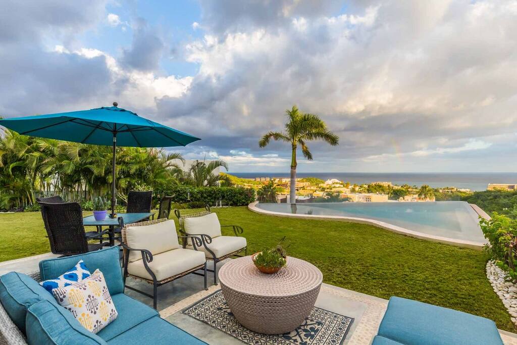Inviting, comfortable outdoor space with ample seating for relaxing and dining.