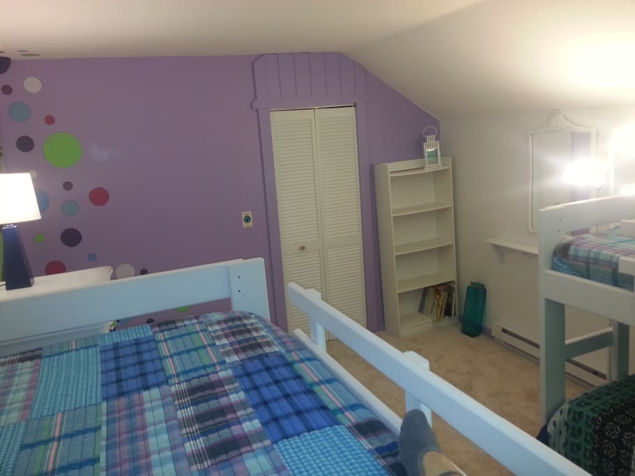 Bright, cheery bedroom with lots of room for gear