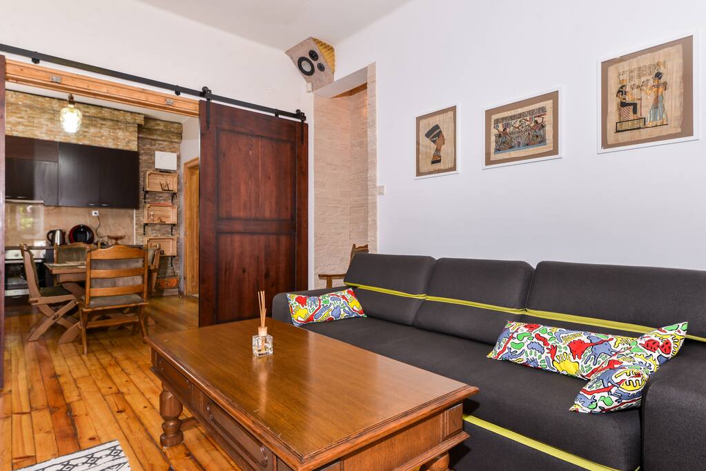 Comfortable living area with a transition to Dining + Kitchen