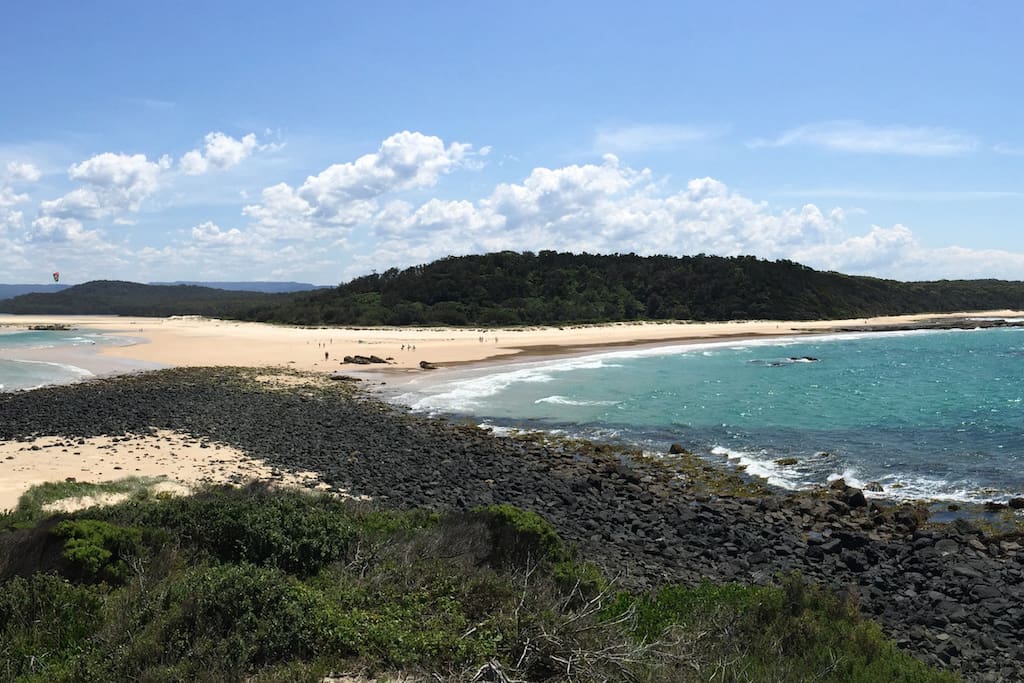 View at low tide from Green Island showing causeway to Cunjurong Point and Manyana Beach (R) and Lake Conjola (L)
