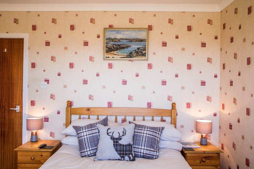 The room has a comfortable double bed with plenty of wardrobe and drawer space.