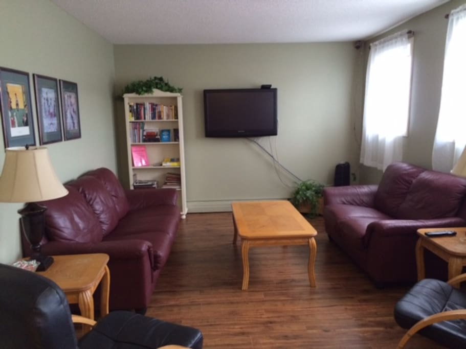Lounge with hardwood flooring