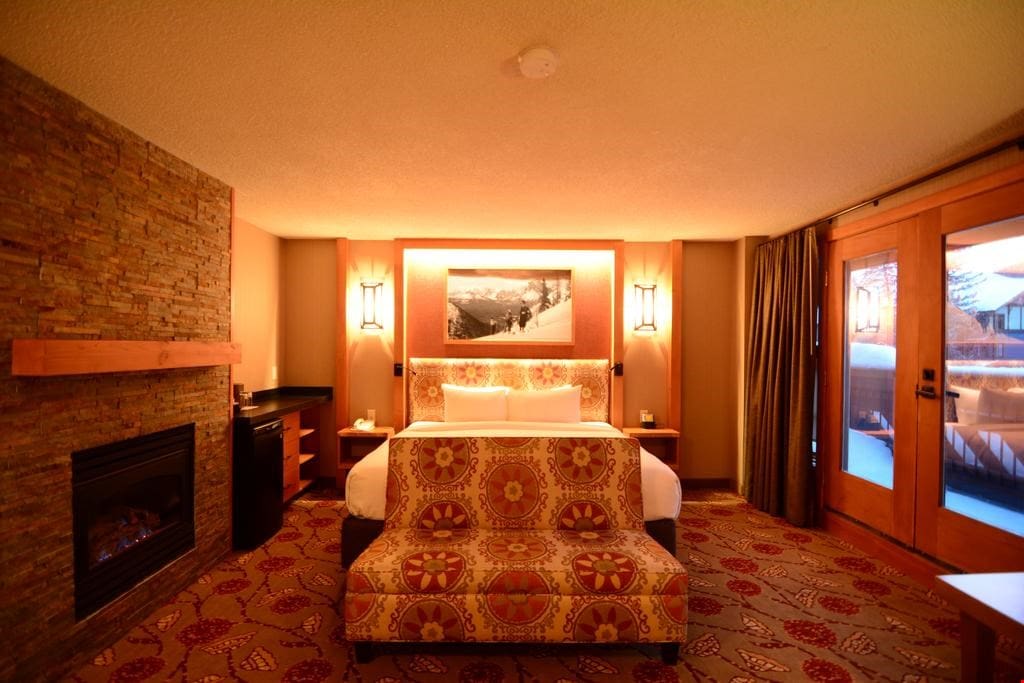 Large windows overlook this elegant and spacious room and feature stunning mountains views!