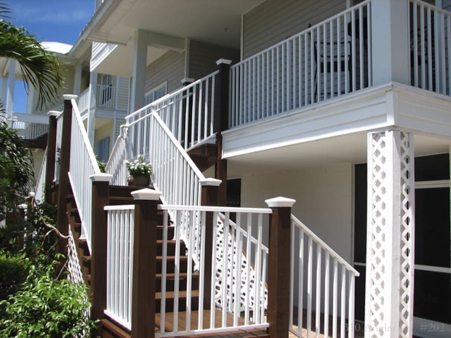 Close-up of previous photo showing Wedding staircase leading to the front door and main living area on the 2nd floor. Private elevator access is also available.