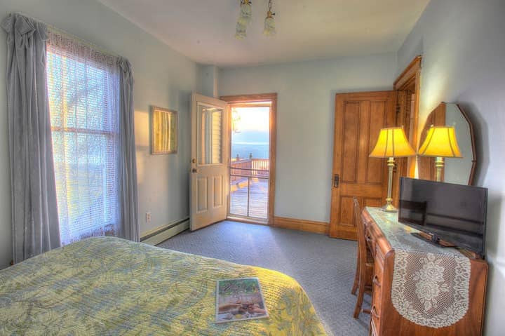 A main-floor bedroom suite with private deck access