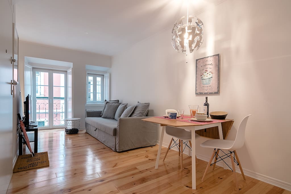 Bright dining and living room with large south windows