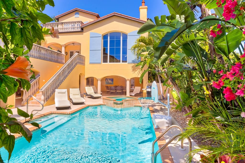 Spectacular pool with spa, bball goal, sun ALL day, massive covered patio, ping pong table, ring game, huge dining table, entrance to 1st floor rooms, bath & elevator.