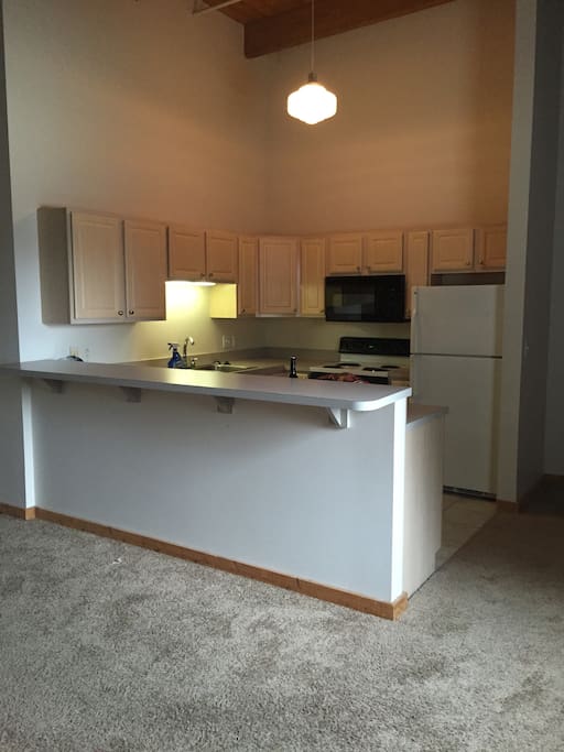 Kitchen: Refrigerator. Dish Washer. 4 top stove. Oven