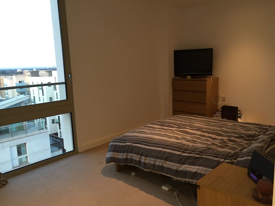 Large double bedroom equipped with a large tv which has Netflix access.
