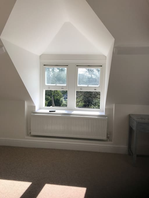 It is a very bright room with both dormer windows and a skylight