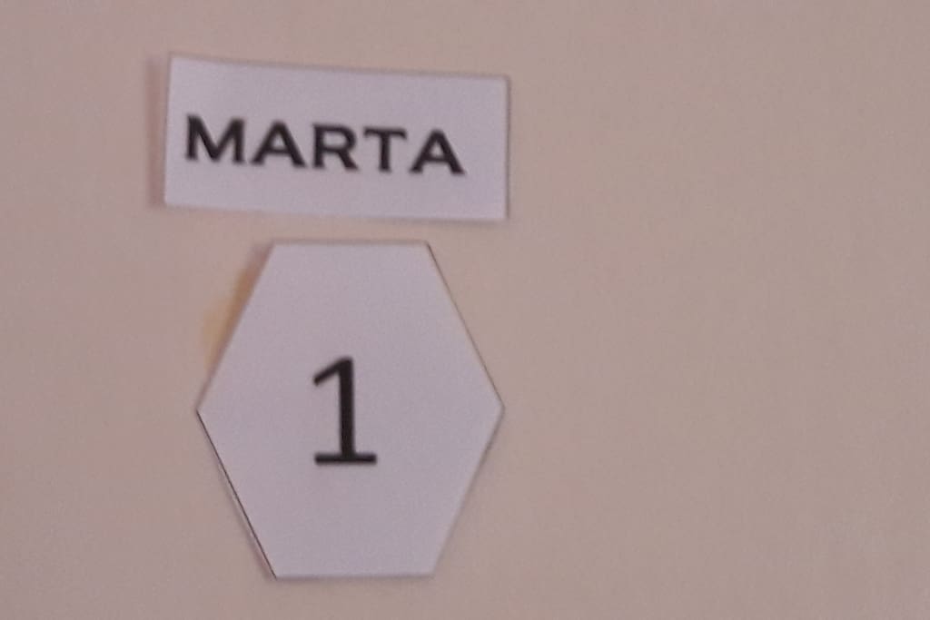 Room Marta - 2 beds, closet, ventilator, table and chairs and balcony on the south