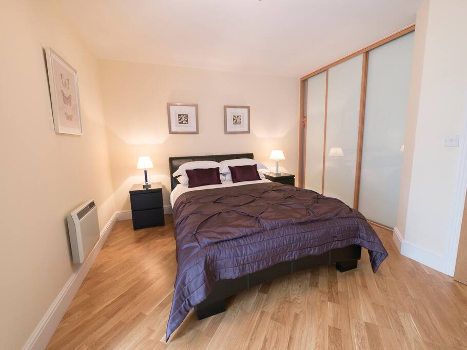Master bedroom with triple length wardrobes