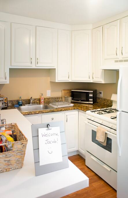 Kitchen stocked with cooking and eating essentials so that you can help yourself to your own home-cooked meal.