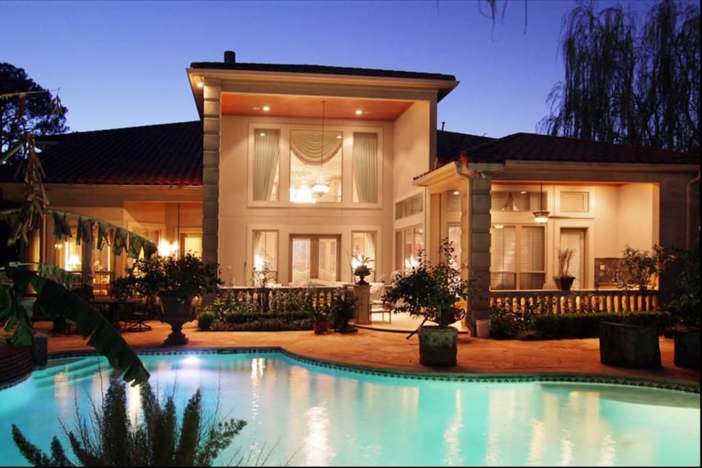 a great home to enjoy with friends and family, outdoor kitchen and pool with flagstone surround and dining under the stars.