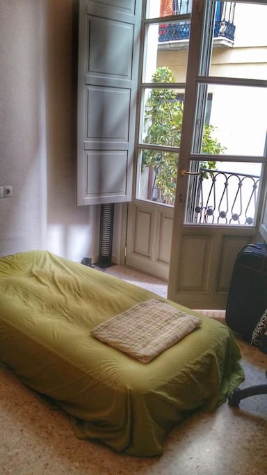 Airbed for one (although I had two adult visitors somehow able to sleep on it without problem), private balcony, desk/chair, and built-in closet.