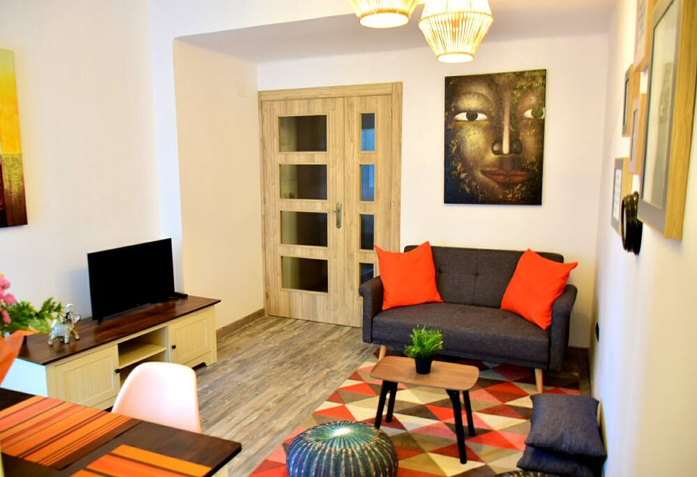 Living room, also used as dining room, as it is provided with table and chairs, perfect space to enjoy meals, watch tv or just have some coffee in the sofa.