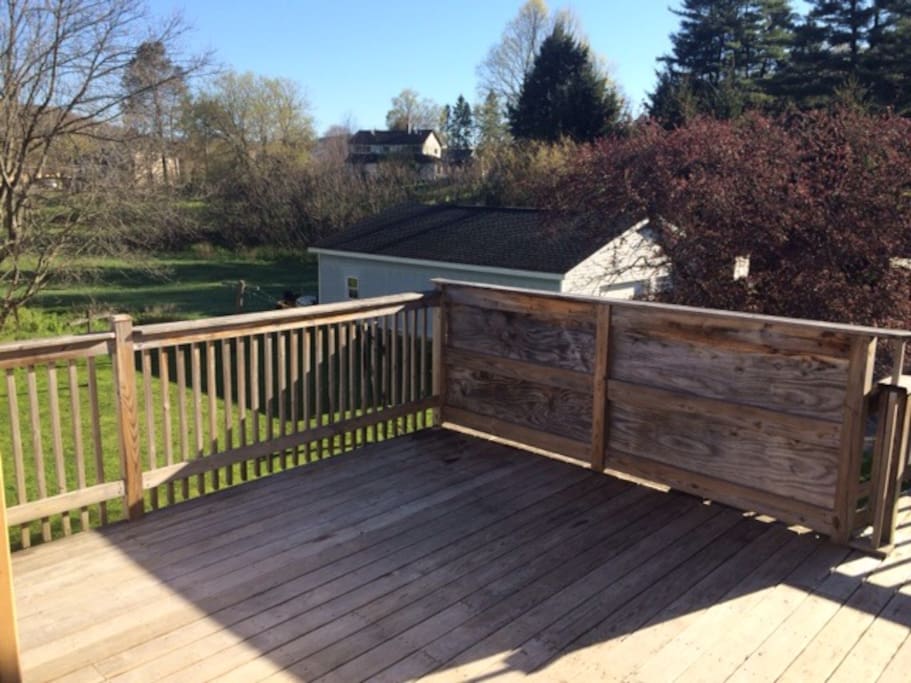 Beautiful deck with seating area,BBQ, big backyard and lots of parking