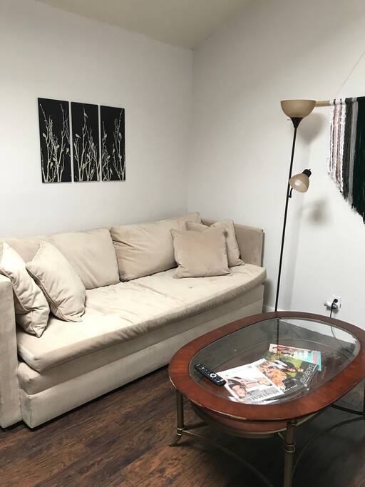Left side living room with feather filled super-comfortable couch and fun decorations.