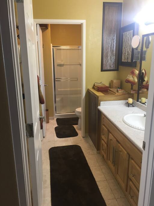 Large bathroom with separate room for toilet/shower.