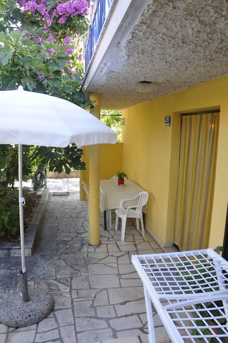 View of the outdoor living areas (sitting & dining) for apartment 1
