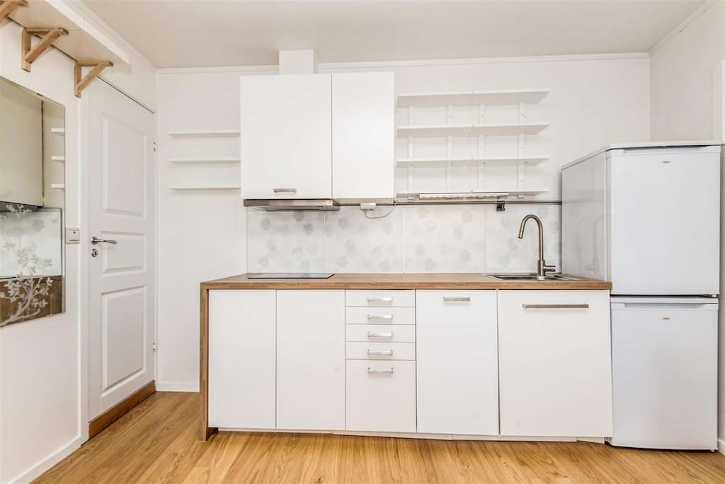 The kitchen features a fridge, freezer, dishwasher and a cooking top. New additions are toasters, a french press and a Dolce Gusto Jovia.
Oven and microwave are in the future plans. The cupboard has been increased to extend over the fridge.