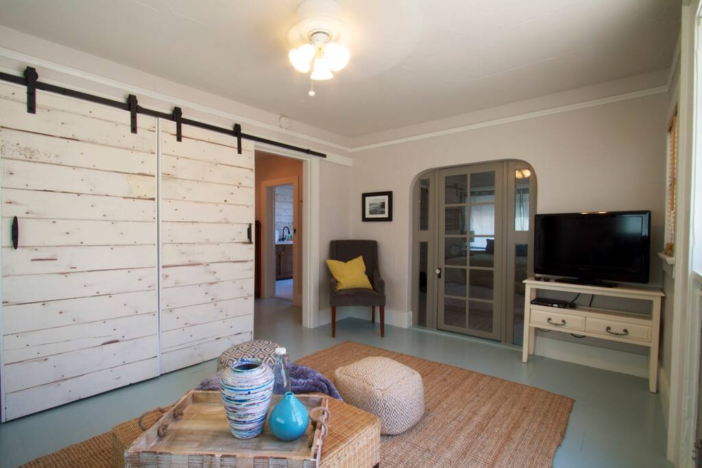 Living space with 32" TV/cable, wifi, glass doors lead to master bedroom