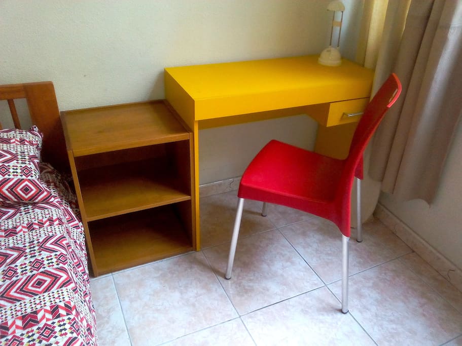 There 2 night table, a desk for your laptop, and a comfortable chairs.