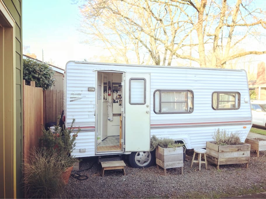 Refurbished vintage trailer in cozy neighborhood.