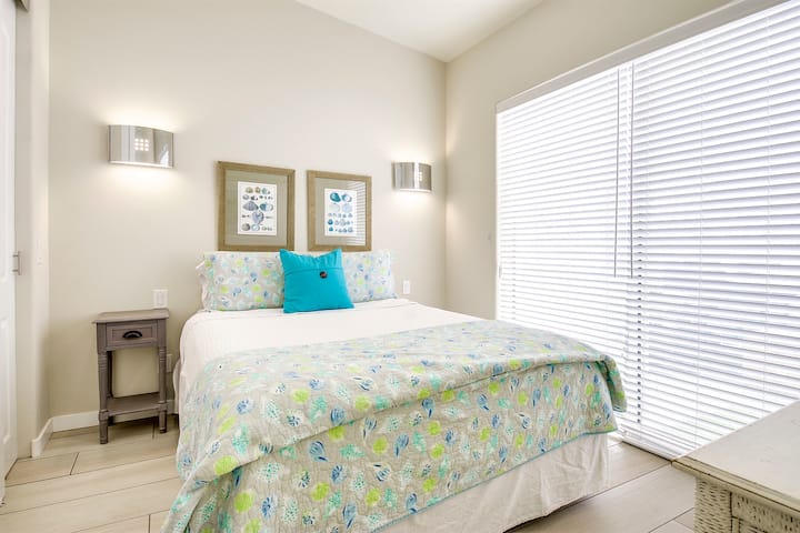 Primary bedroom featuring a comfortable queen-sized bed.