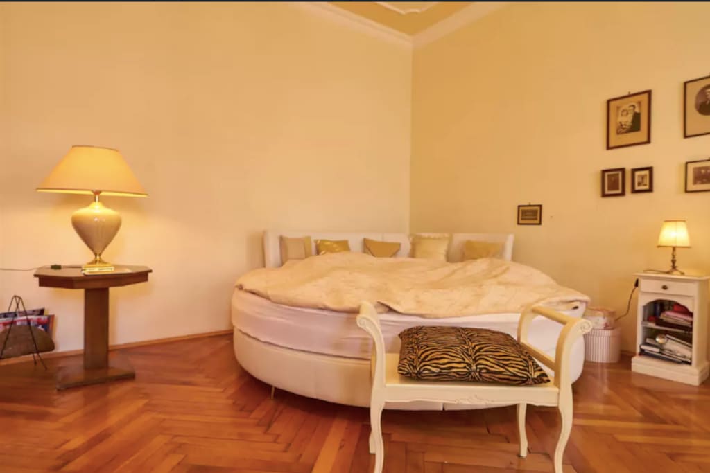 Large round king size bed in the bedroom. .