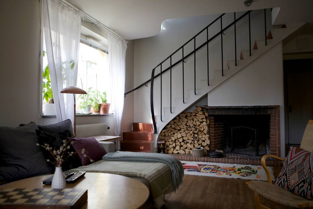 Livingroom opposite angle, with staircase leading up to 1st floor.