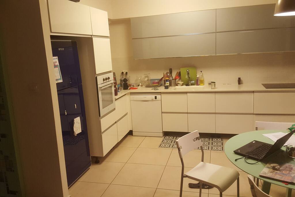 Our kitchen. It has everything you need: An oven, dishwasher, stove, microwave oven, juice extractor, espresso machine and much more