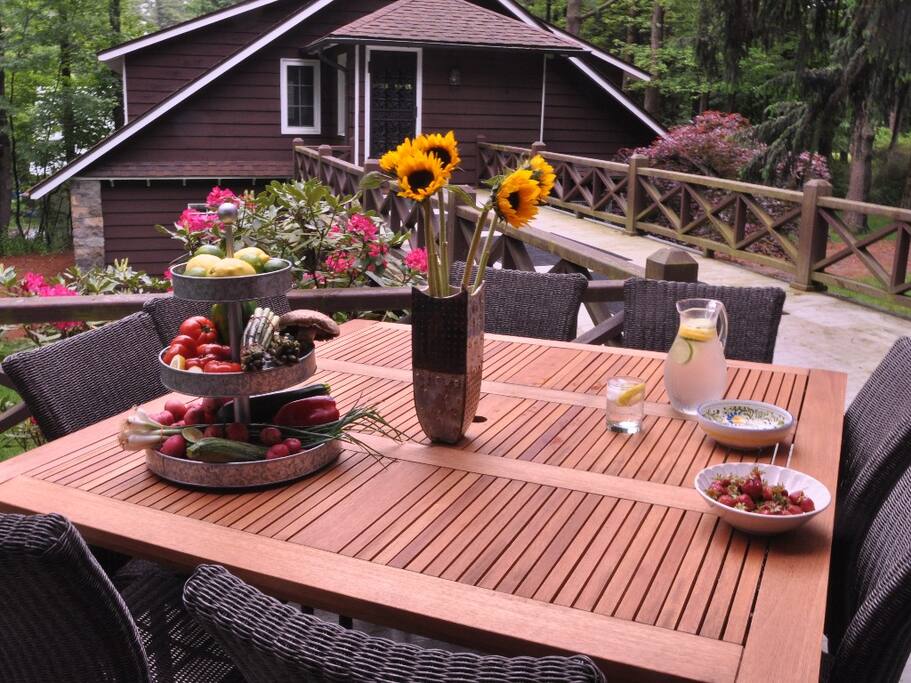 Beautiful porch with outdoor seating and propane grill.