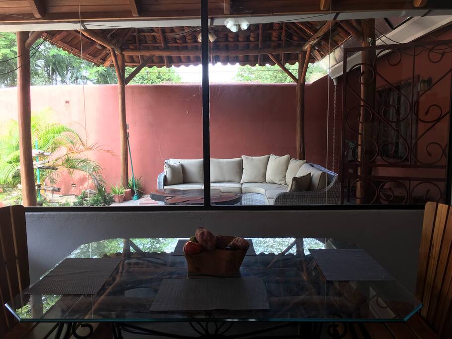 New six seater sectional under the shelter of the rancho. As seen here from inside the kitchen.