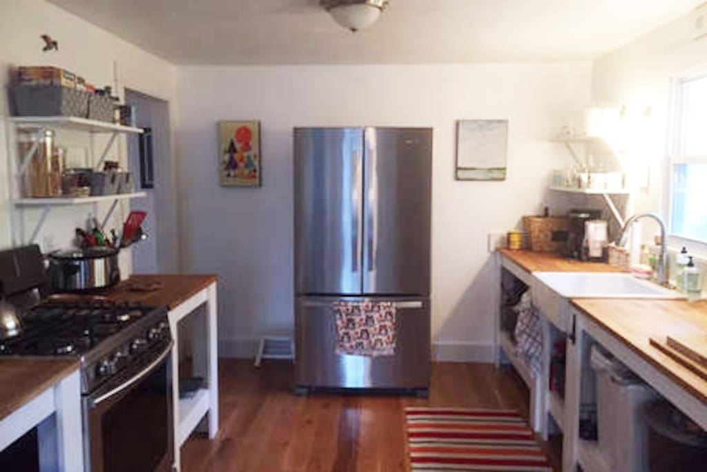 Kitchen w/plenty of counter space, full size fridge, gas stove, microwave, toaster.